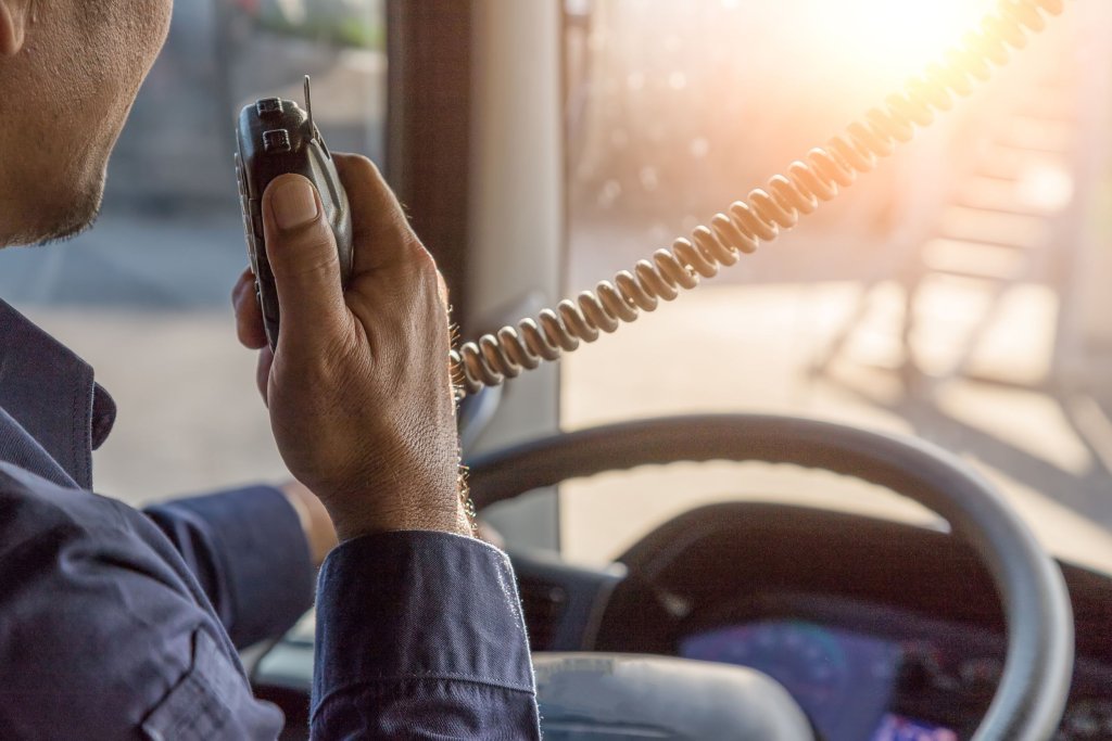 truck driver using his radio to talk